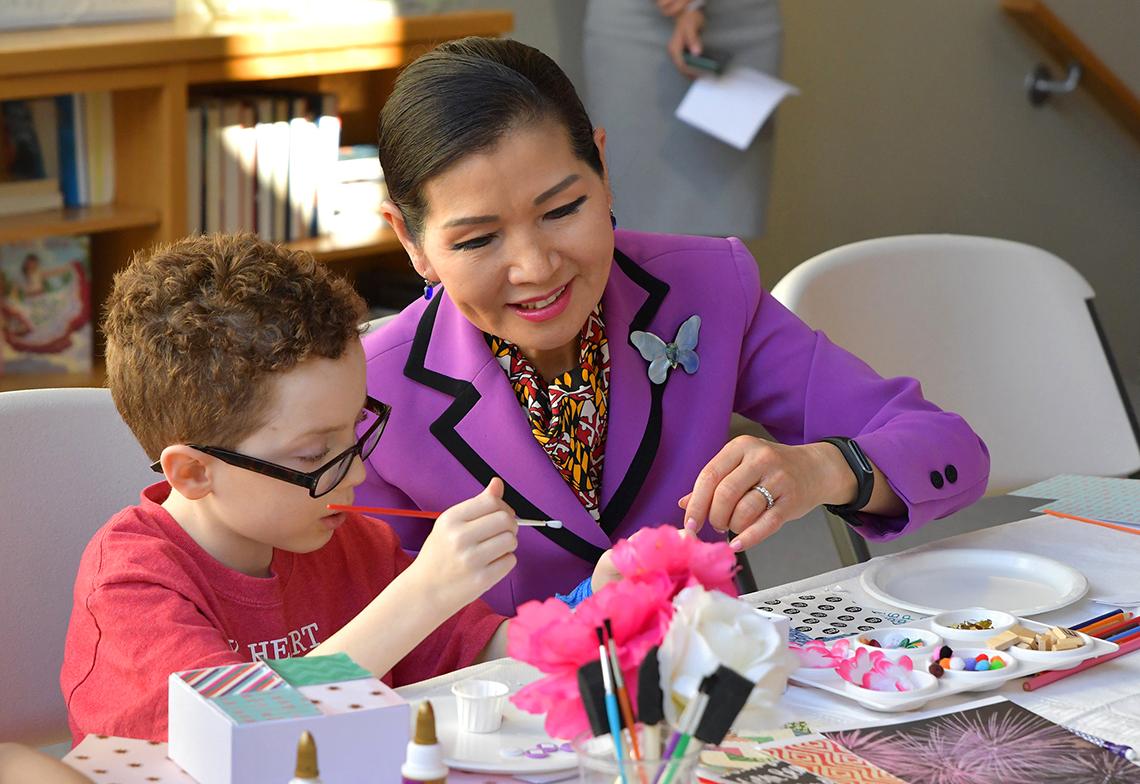 Mrs. Hogan and child at table