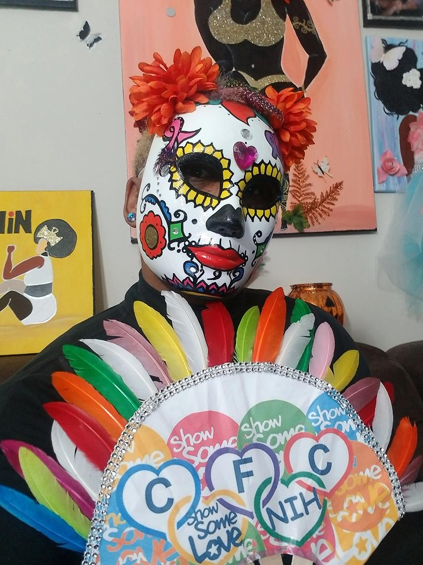 Colorful costume with paper feathers and CFC theme on breastplate