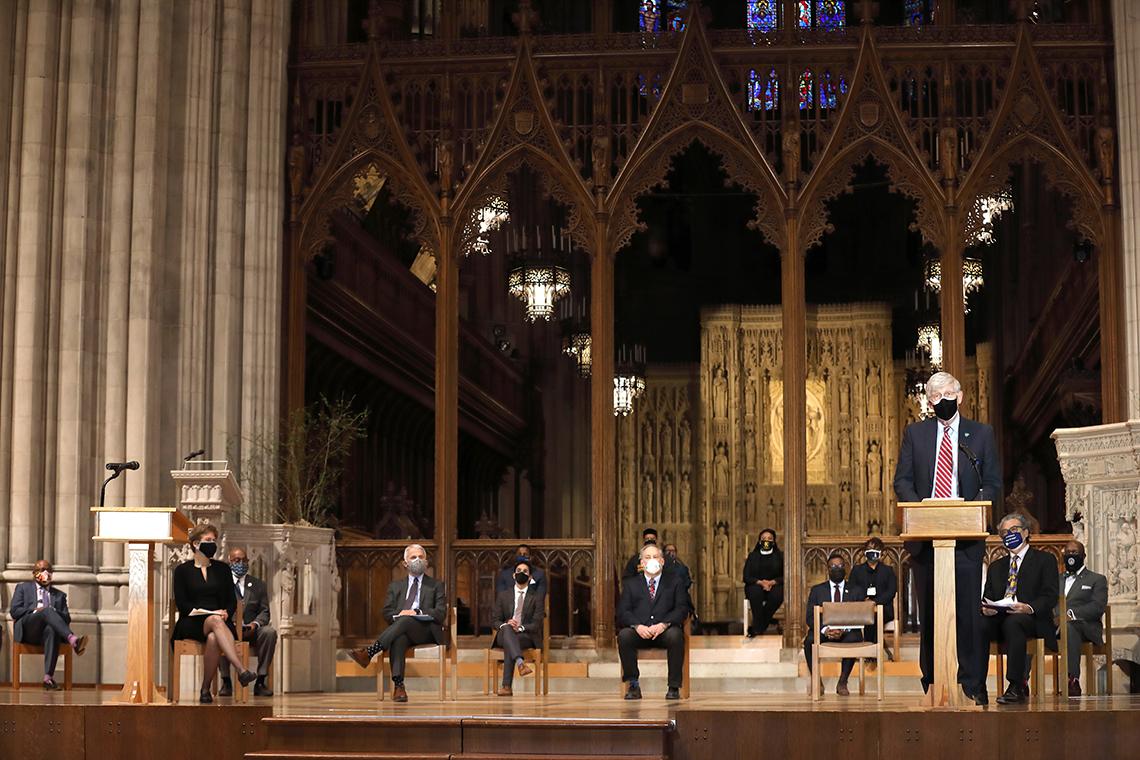 Collins speaks from the lectern