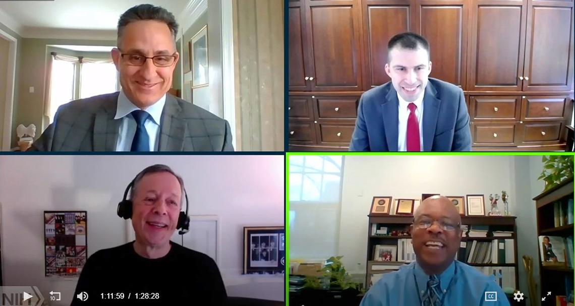 Nick Morgan and NIH's Jason Ford, Rodney Rivera and Dr. Alfred Johnson laughing together during Morgan's presentation.