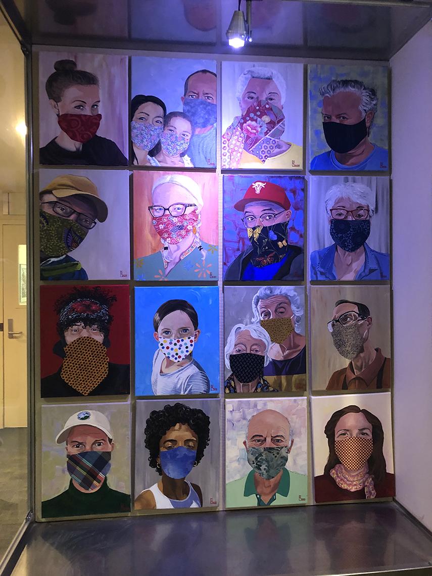 Paintings of people wearing face masks on display at Clinical Center