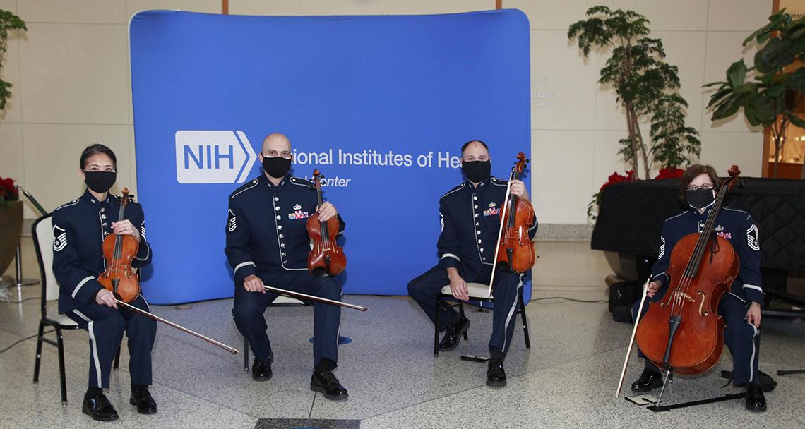 String quartet is seated at atrium.