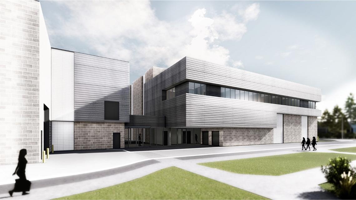 Drawing of multi-level building with upper-level modular bump-out.