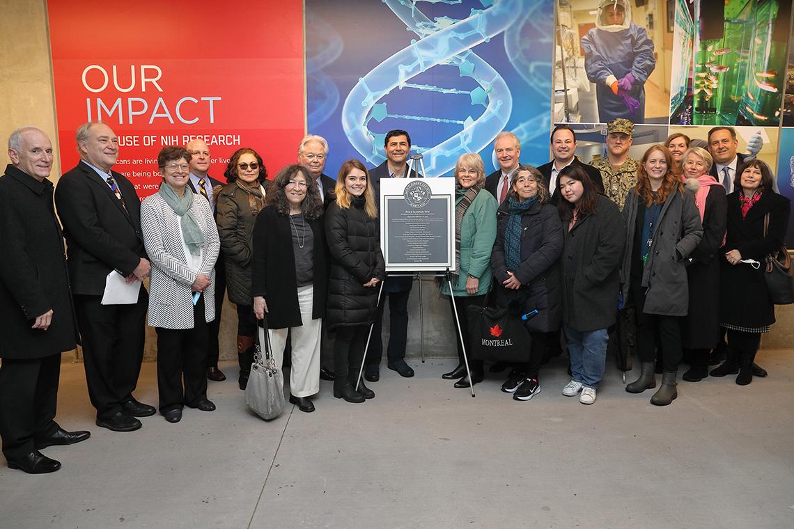 Representatives from several organizations smile into camera.