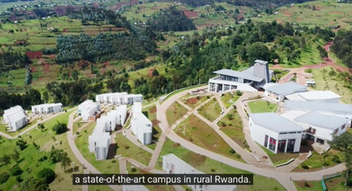 The modern hospital and university complex sits on a mountaintop, with newly built roads providing access.