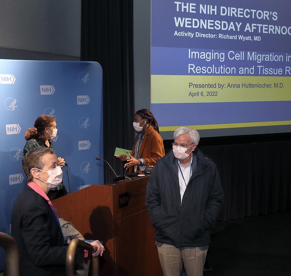 Four scientists speaks with each other after the lecture