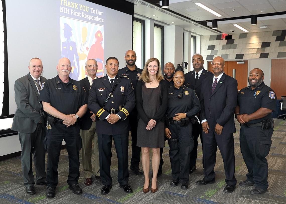 Large group of people, some in uniform