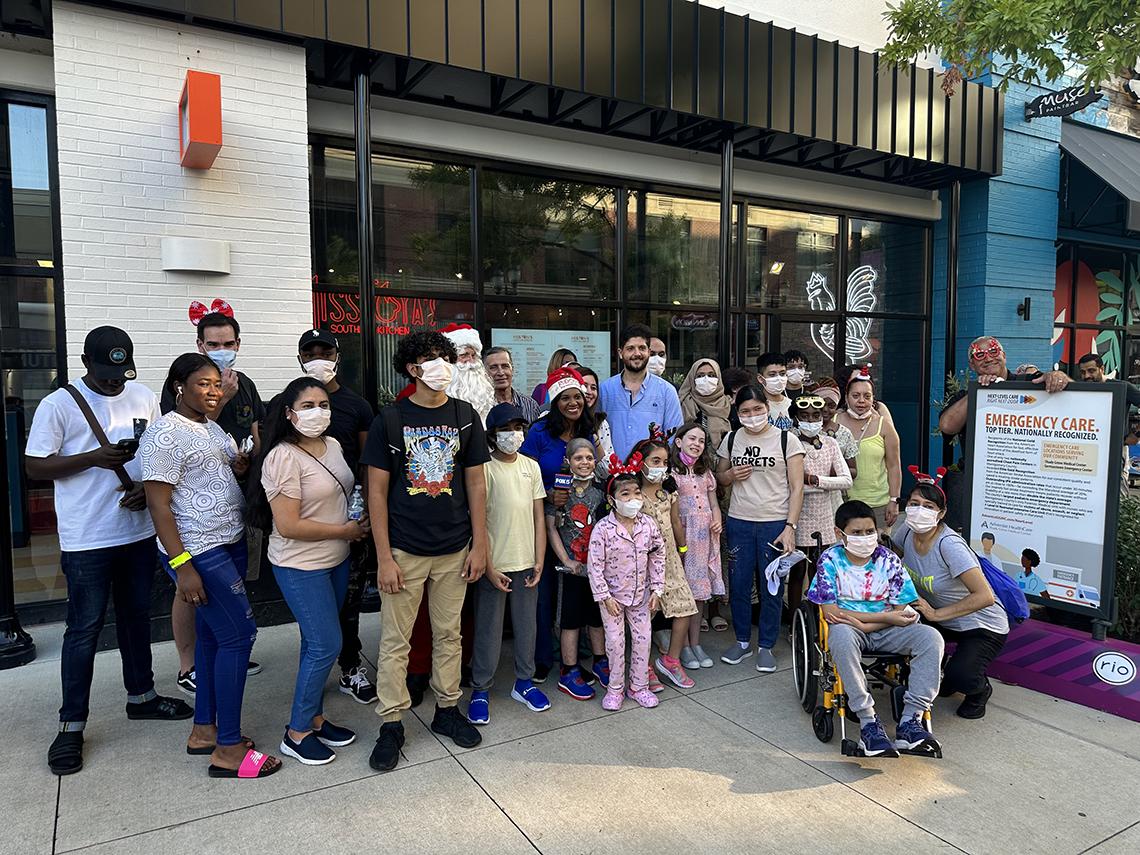 A group photo featuring families out front of Miss Toya's