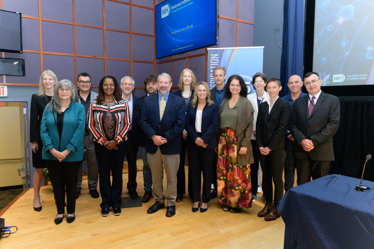 A group photo of every speaker at the sympoium.