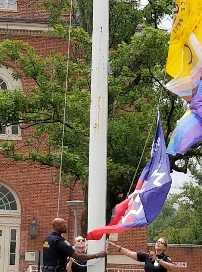 Officers raise the flag