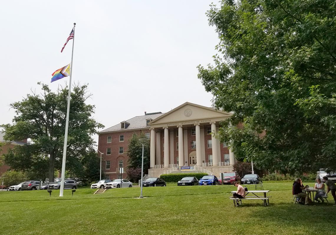 The Pride flag flies in front of Bldg. 1.