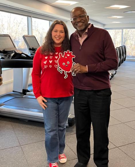 Ammary-Risch and Gibbons pose together in front of treadmills.
