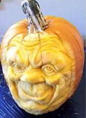 Elaborately detailed carving of a face vaguely resembling E.T. the Extra-Terrestrial