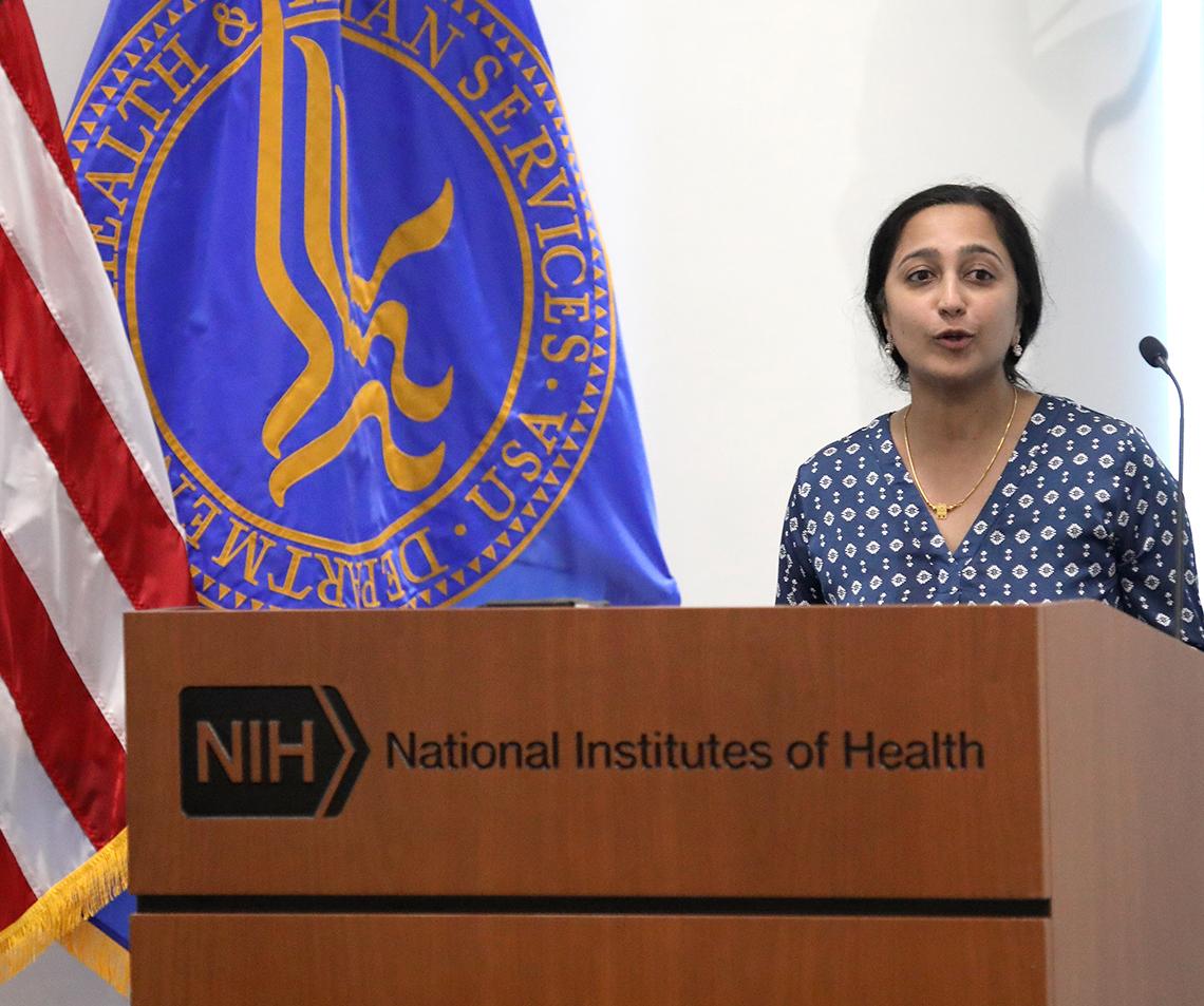 Rajan presents her lecture at a podium