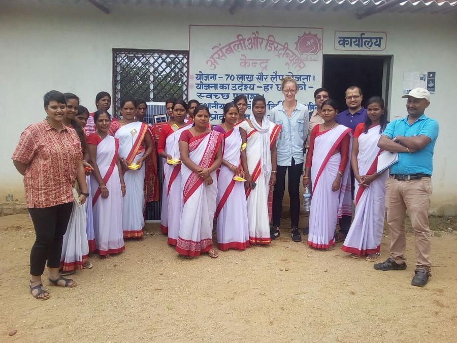 Kumar and several colleagues pose with SoULS participants.