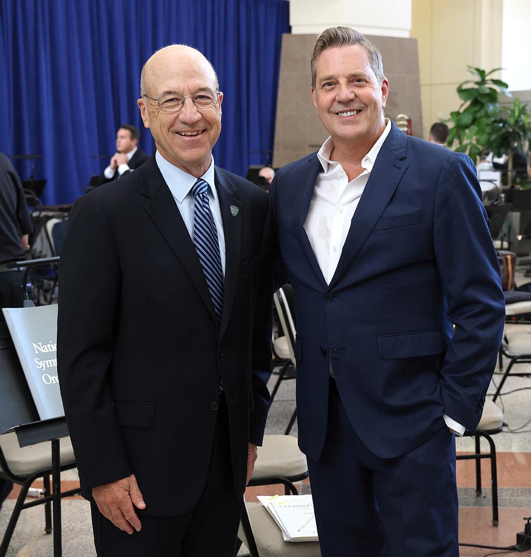 Gilman poses with NSO conductor before the concert.