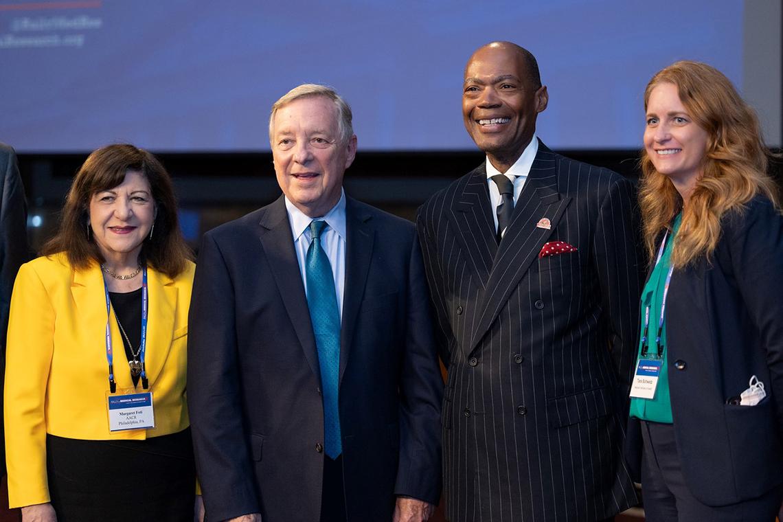 Schwetz and three others smile for a picture