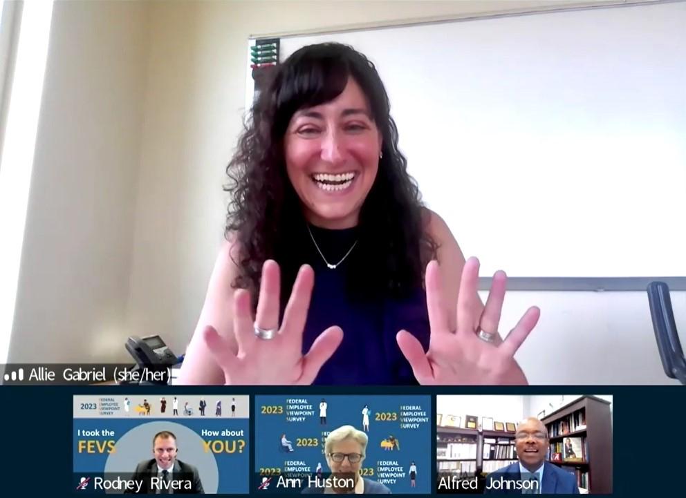 Hands up, fingers spread, and a huge smile, Gabriel chats with Rivera, Huston and Johnson