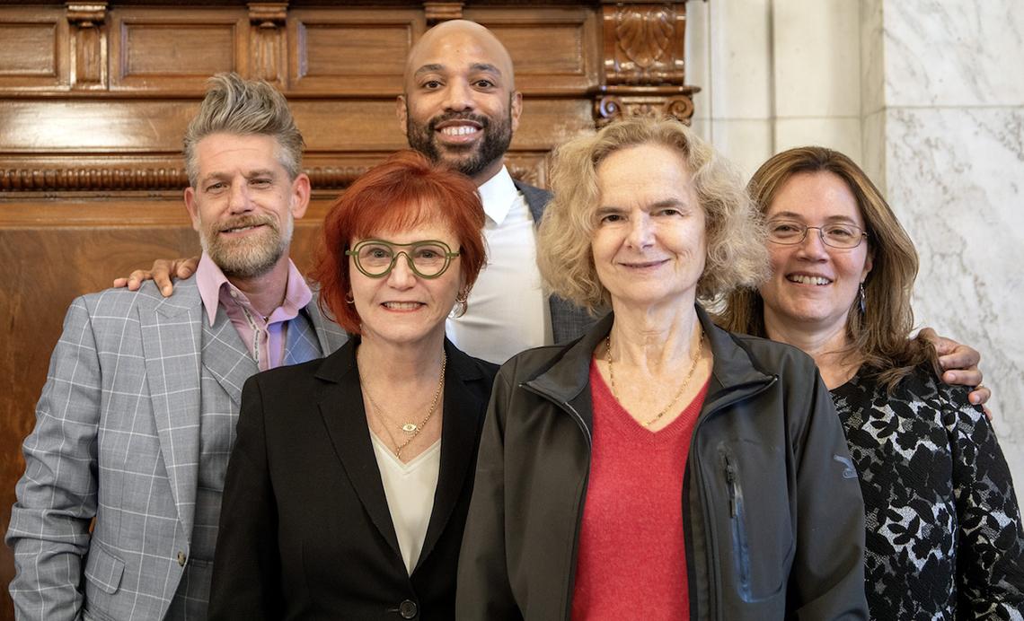 A group poses with Volkow.