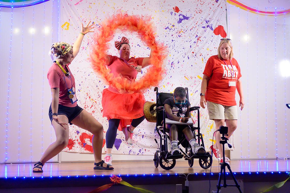 Counselors and campers take part in a talent show