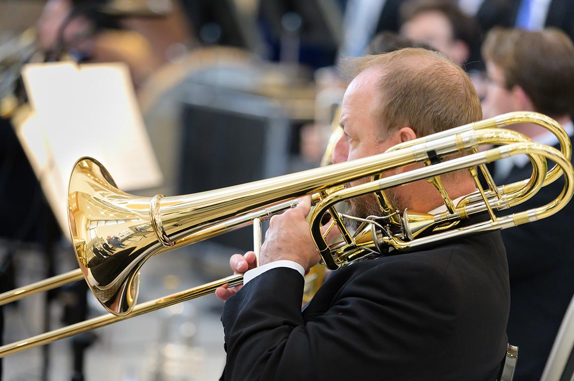 A man plays trombone.