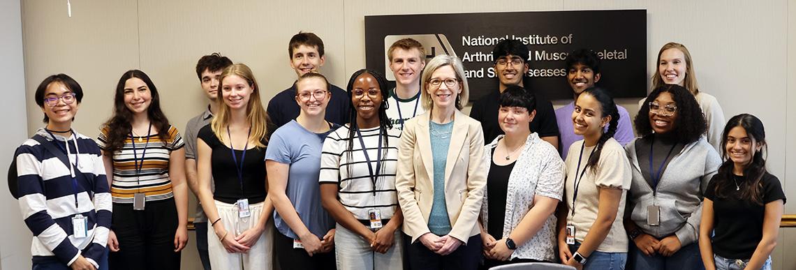 Group of students pose with NIAMS director