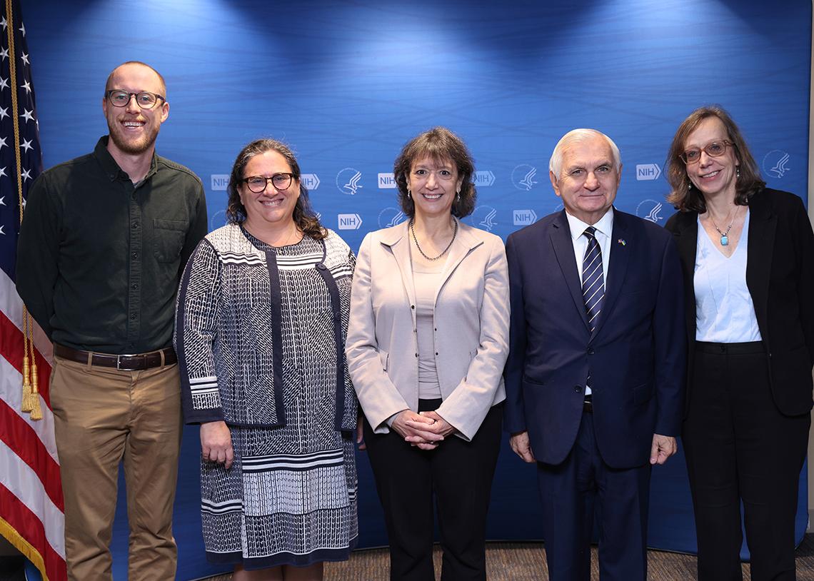 A group photo featuring Reed and several NIH employees
