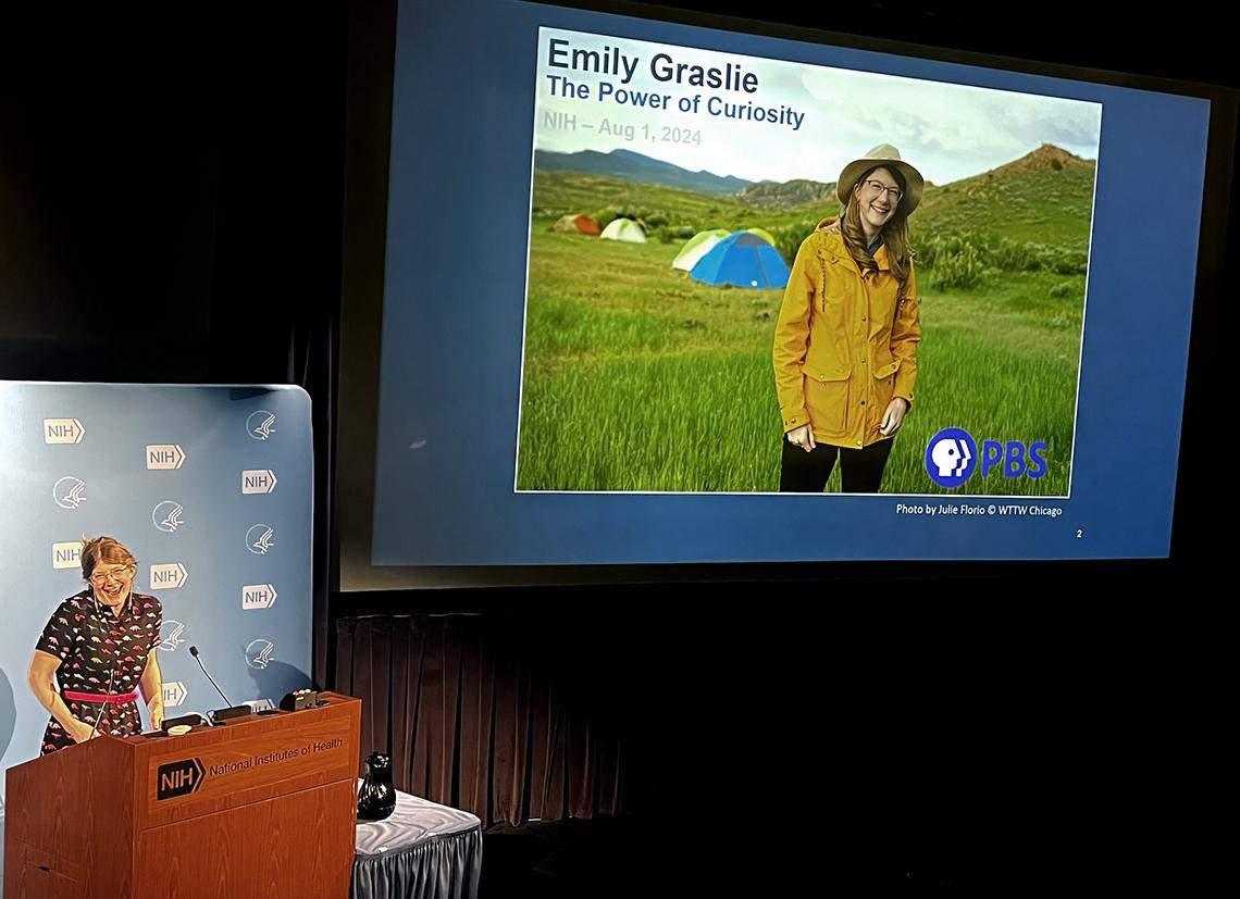 Graslie speaks at a podium