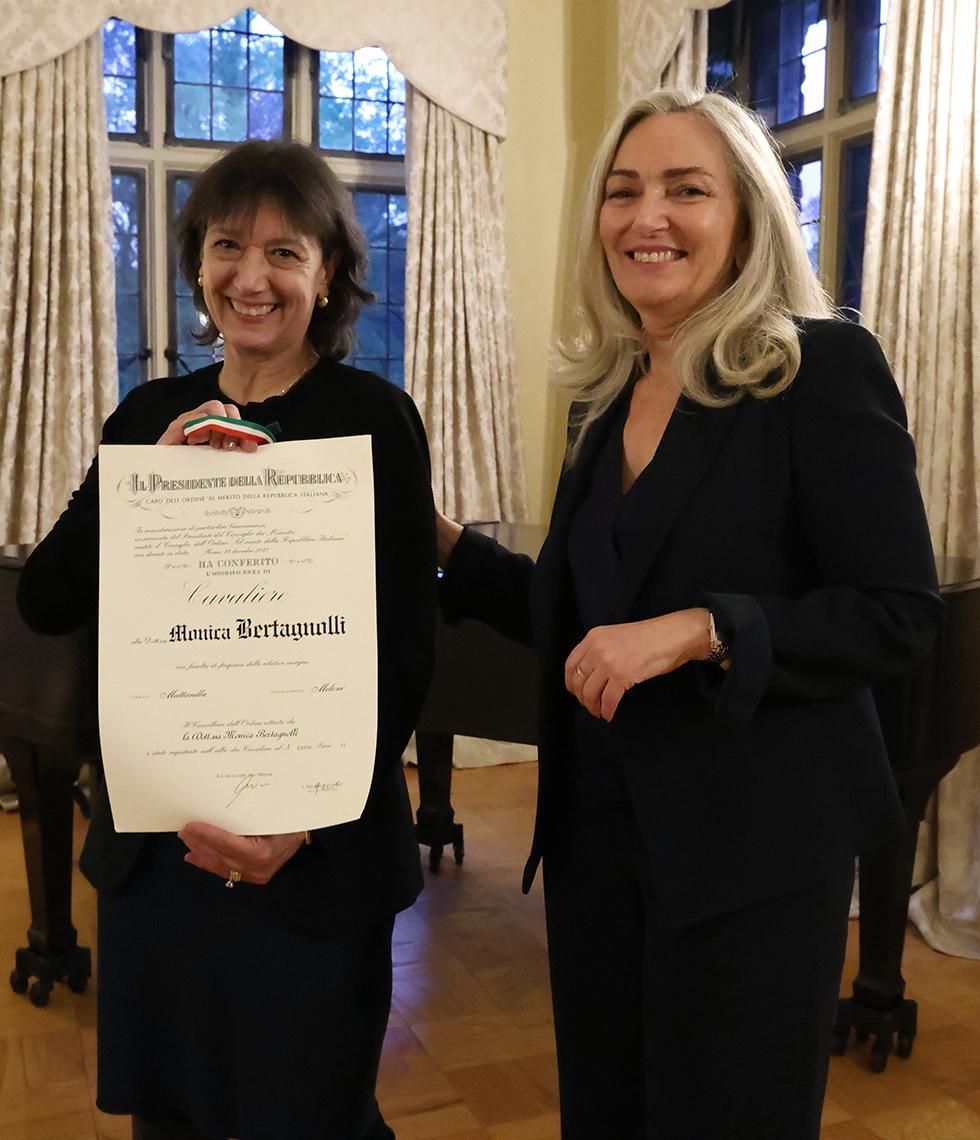 Bertagnolli poses with her certificate next to Zappia.