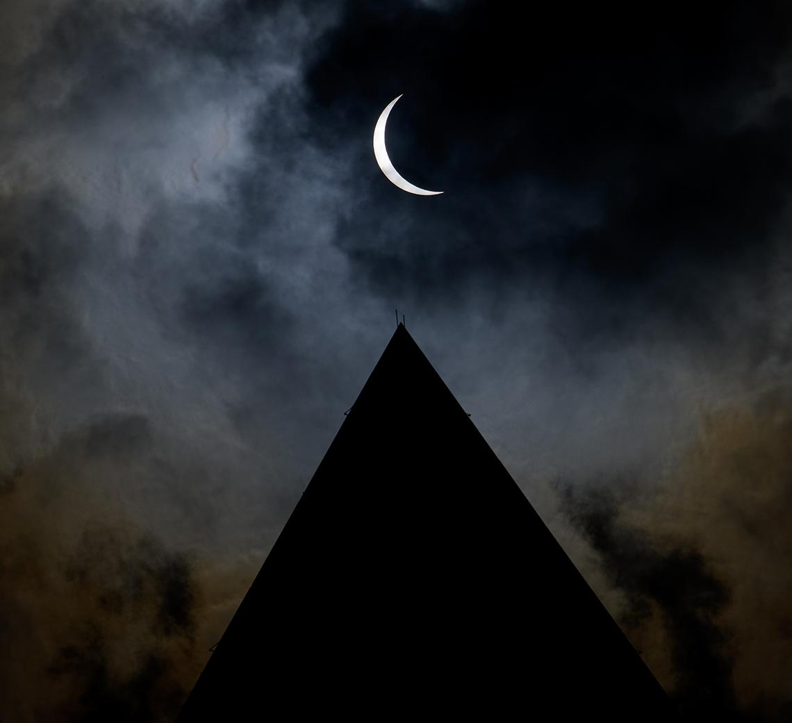 The partial eclipse seen above the Washington monument