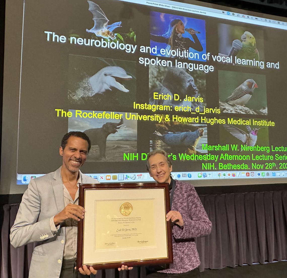 Jarvis accepts a plaque from Schor 