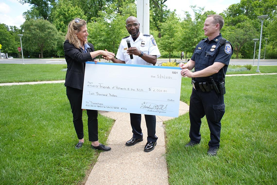 Spruill presents a donation to Brake