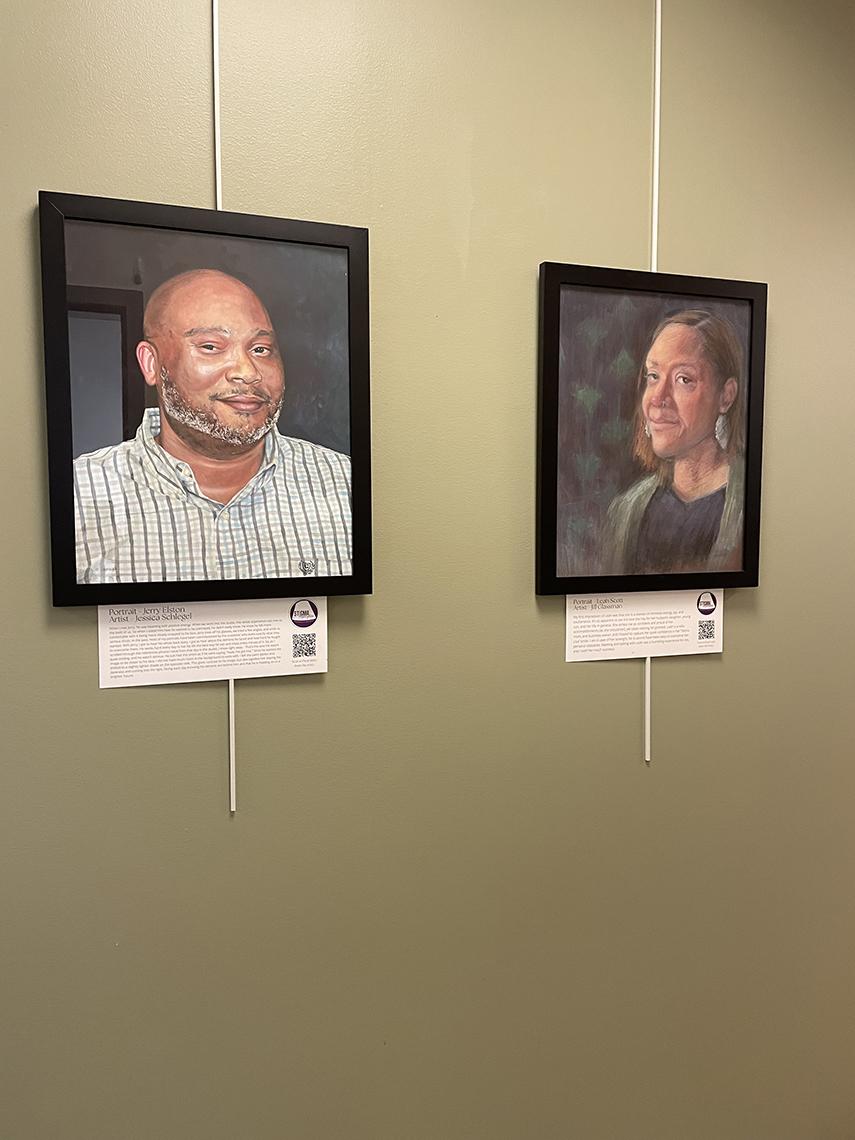 Two paintings hang side-by-side