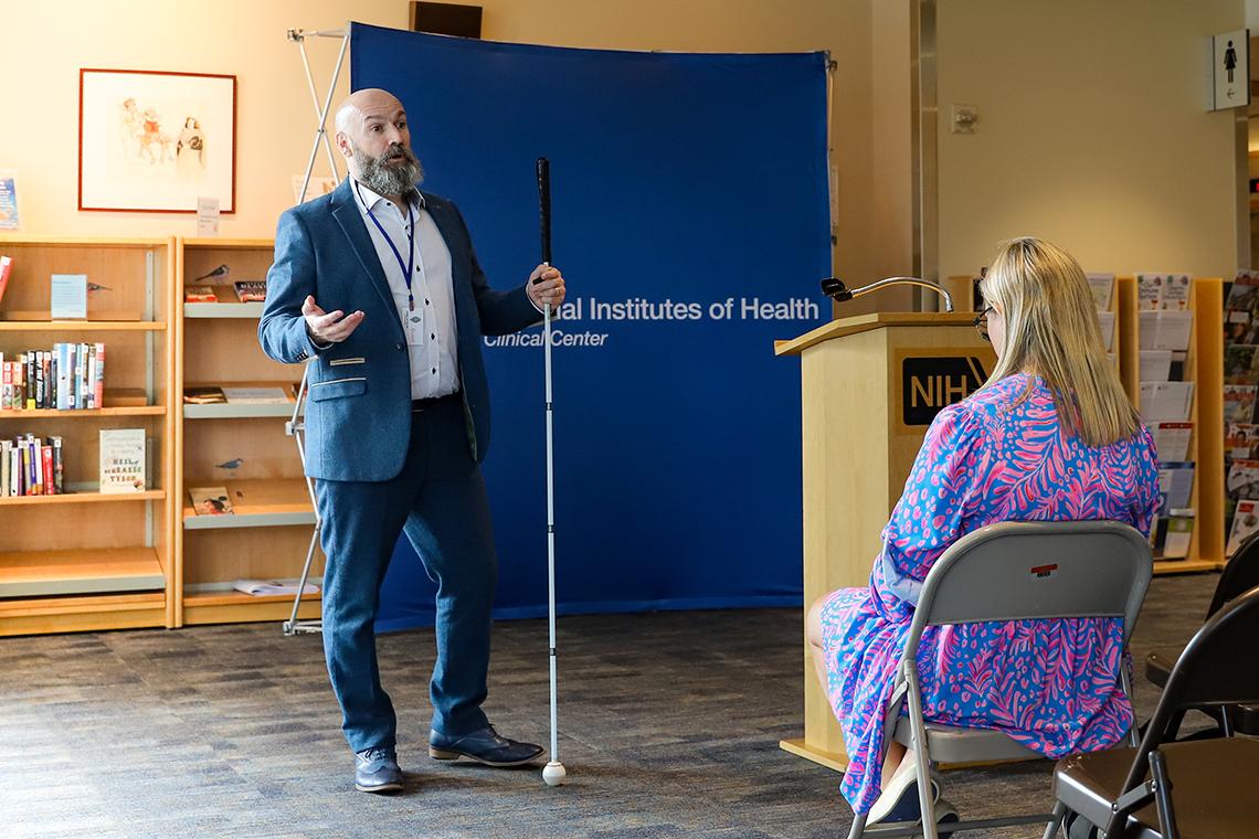 Steele presents at the front of a room