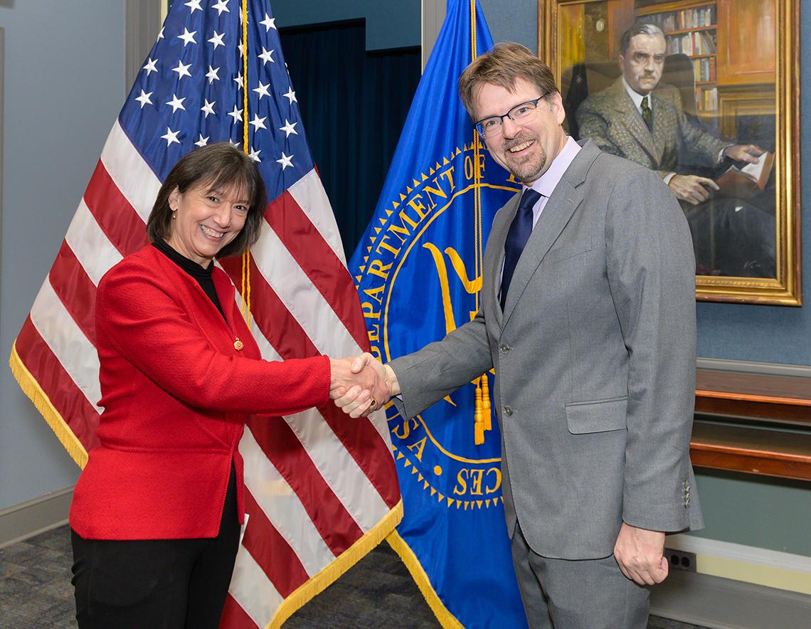 Bertagnolli shakes hands with Mooney.