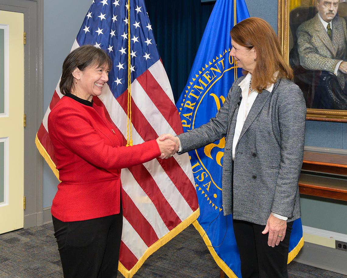 Bertagnolli shakes hands with Neuzil.