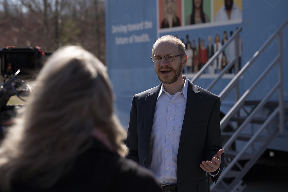 Denny speaks to someone