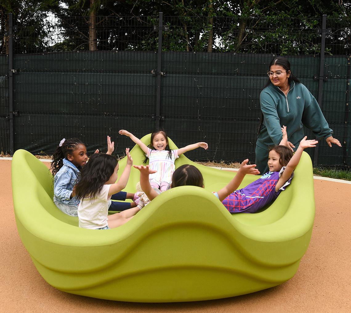 Children play on the playground equipment