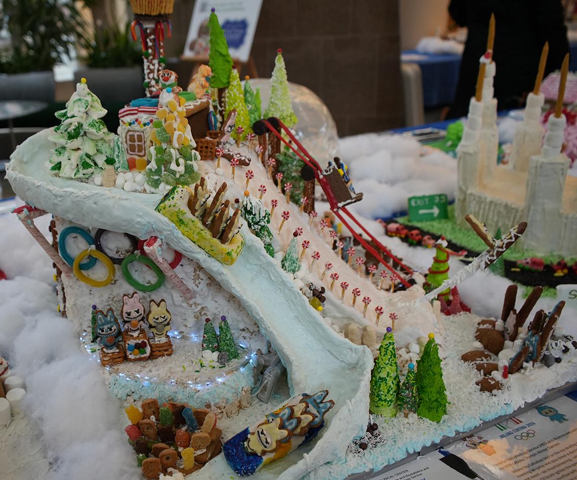 a winter wonderland, labubus on a luge, ski slope and the 5 colorful Olympic rings