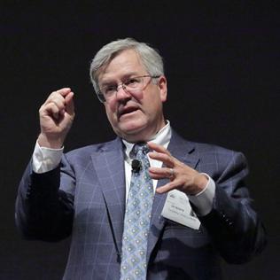 O’Halloran pinches two fingers together while speaking 