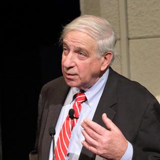 Maron speaks at podium