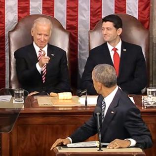 Obama turns to see a smiling Biden pointing at him next to a smiling Ryan at the State of the Union address in the Capitol.