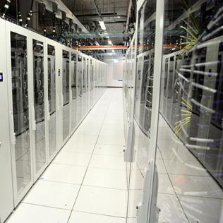 Room of glass-enclosed servers