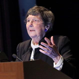 Dr. Holland addresses audience.