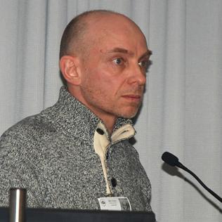 Cecchi speaks at podium