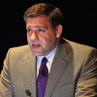 Dr. Matthew Memoli speaks at podium