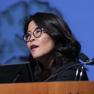 Dr. Wendy Suzuki speaks at podium