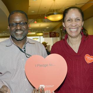  Gibbons and Johnson hold up giant red heart