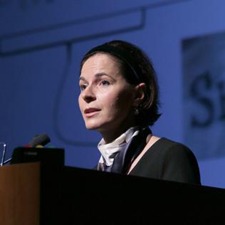 Dr. Yasmine Belkaid at podium