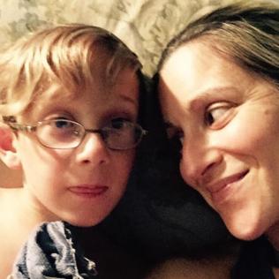 Carly Israel-Agin smiles at her young son Desi